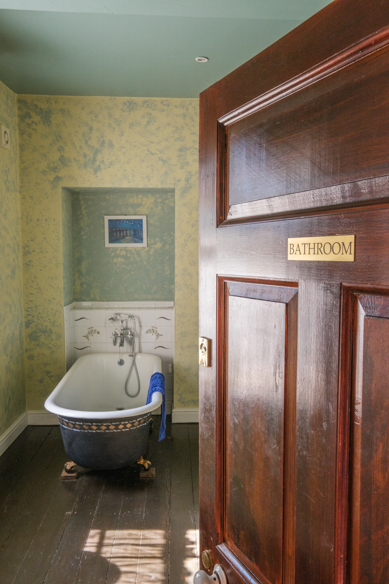 Private guest bathroom with victorian bathtub